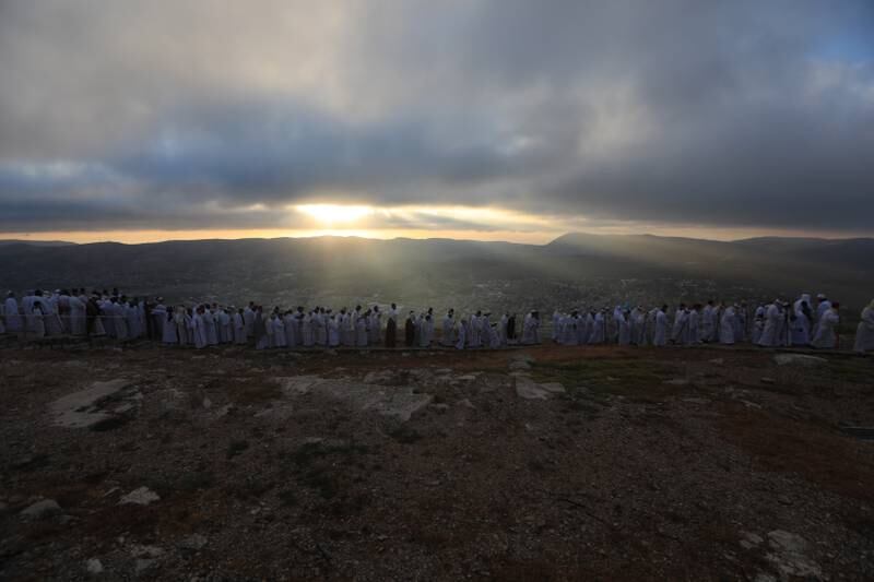 Members of the Samaritan community attend a religious service marking the end of their Passover holiday atop Mount Gerizim, above the West Bank city of Nablus. EPA