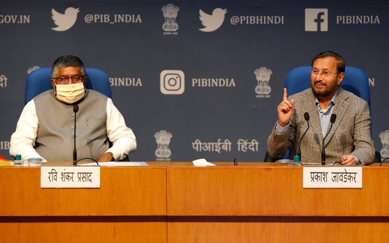FILE - In this Thursday, Feb. 25, 2021, file photo, India's Information Technology Minister Ravi Shankar Prasad, left, and Information and Broadcasting Minister Prakash Javadekar address a press conference announcing new regulations for social media companies and digital streaming websites in New Delhi, India. Indiaâ€™s government on Saturday, June 5, warned Twitter to immediately comply with the countryâ€™s new social media regulations, which critics say give the government more power to police online content. (AP Photo/Manish Swarup, File)