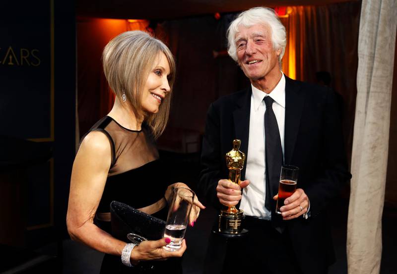 Roger Deakins holds the Oscar for Best Cinematography for "1917" as he and his wife Isabella James Purefoy Ellis attend the Governors Ball after the Oscars on Sunday, February 9, 2020, at the Dolby Theatre in Los Angeles. Reuters