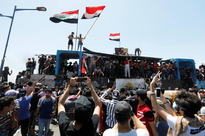 Demonstrators gesture as they take part in the ongoing anti-government protests after newly-appointed Iraqi Prime Minister Mustafa Kadhimi called for the release of all detained protesters, at Al Jumhuriya bridge in Baghdad, Iraq. REUTERS