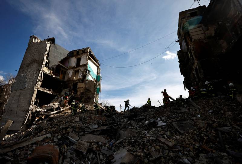 Rescuers work among remains of residential building destroyed by Russian shelling in Borodyanka, Kyiv region. Reuters