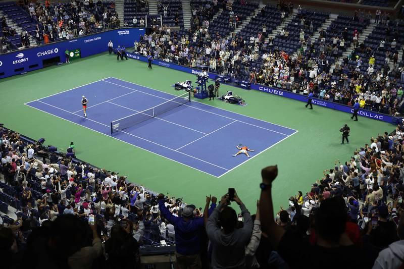 Carlos Alcaraz lies on the court after beating Jannik Sinner at the US Open. AFP
