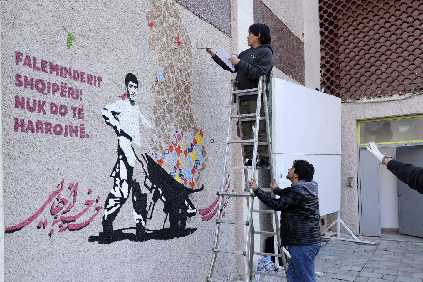 The mural calls on Afghans not to forget their brethren. Photo: AP