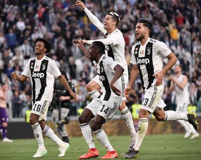 Cristiano Ronaldo,  Juan Cuadrado, Blaise Matuidi and Emre Can celebrate in front of the fans after Juventus won the Serie A title. AFP