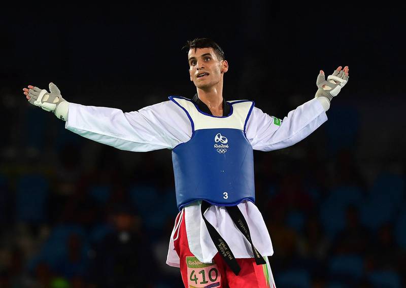 RIO DE JANEIRO, BRAZIL - AUGUST 18: Ahmad Abughaush of Jordan celebrates victory over Joel Bonilla Gonzalez of Spain during the Mens 68kg Taekwondo semi final contest at Cairoca Arena 3  on August 18, 2016 in Rio de Janeiro, Brazil.  (Photo by Laurence Griffiths/Getty Images)