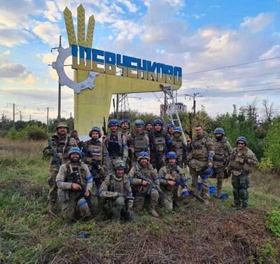 Ukrainian troops in the recently retaken settlement of Vasylenkove. Reuters