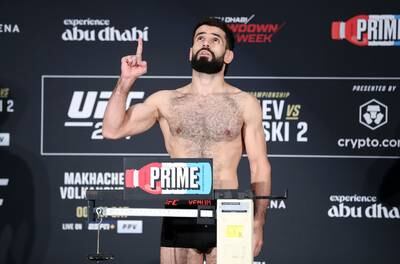 UFC featherweight Muhammad Naimov weighs in for his fight against Nathaniel Wood at UFC 294.