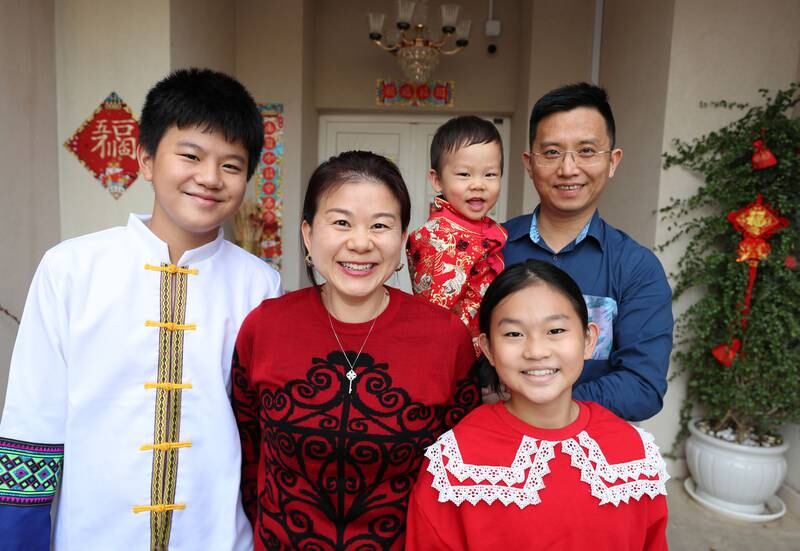 The Chen family, from left, Jeffrey 12, mother Daisy, Jasper, 22 months, Sabrina, 9, and father Leo celebrate the Lunar New Year at home in Dubai. Chris Whiteoak / The National