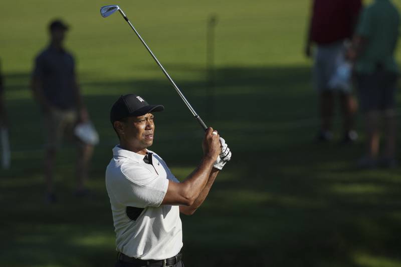 Tiger Woods watches his second fairway shot on the 10th hole  during a practice round for the PGA Championship. Reuters