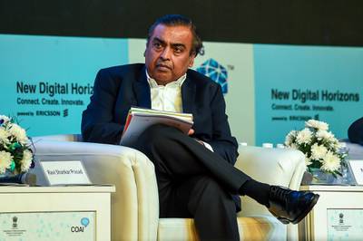 (FILES) In this file photo taken on October 25, 2018 India's richest man and oil-to-telecom conglomerate Reliance Industries chairman Mukesh Ambani attends the India Mobile Congress 2018 in New Delhi. - With global tech giants pumping billions into Reliance, India's richest man is ready to battle Amazon and Walmart for the country's huge e-commerce market. But analysts say it's far from certain that Mukesh Ambani's latest big gamble will pay off. (Photo by CHANDAN KHANNA / AFP) / TO GO WITH AFP STORY INDIA-ECONOMY-RETAIL-ECOMMERCE-RELIANCE-AMBANI,FOCUS BY VISHAL MANVE AND AMMU KANNAMPILLY