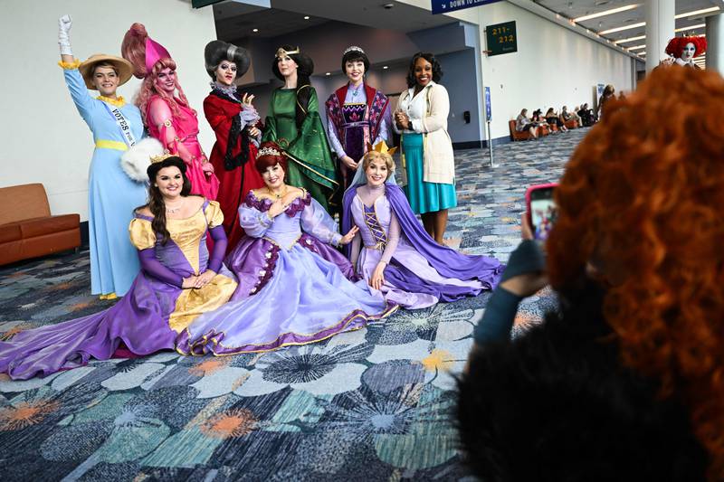 Cosplay fans as mothers from Disney films during the Walt Disney D23 Expo in Anaheim, California. AFP