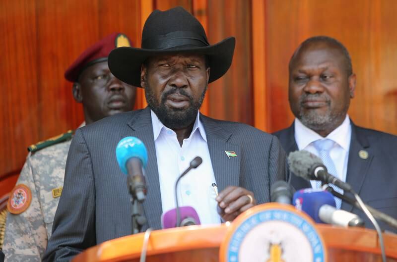 South Sudan's President Salva Kiir Mayardit flanked by ex-vice President and former rebel leader Riek Machar address a news conference at the State House in Juba, South Sudan February 20, 2020. Reuters