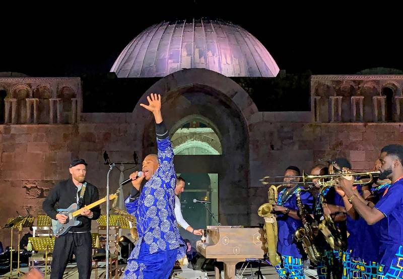 Nigerian musician Femi Kuti, second, left) performs with Coldplay at the Citadel.