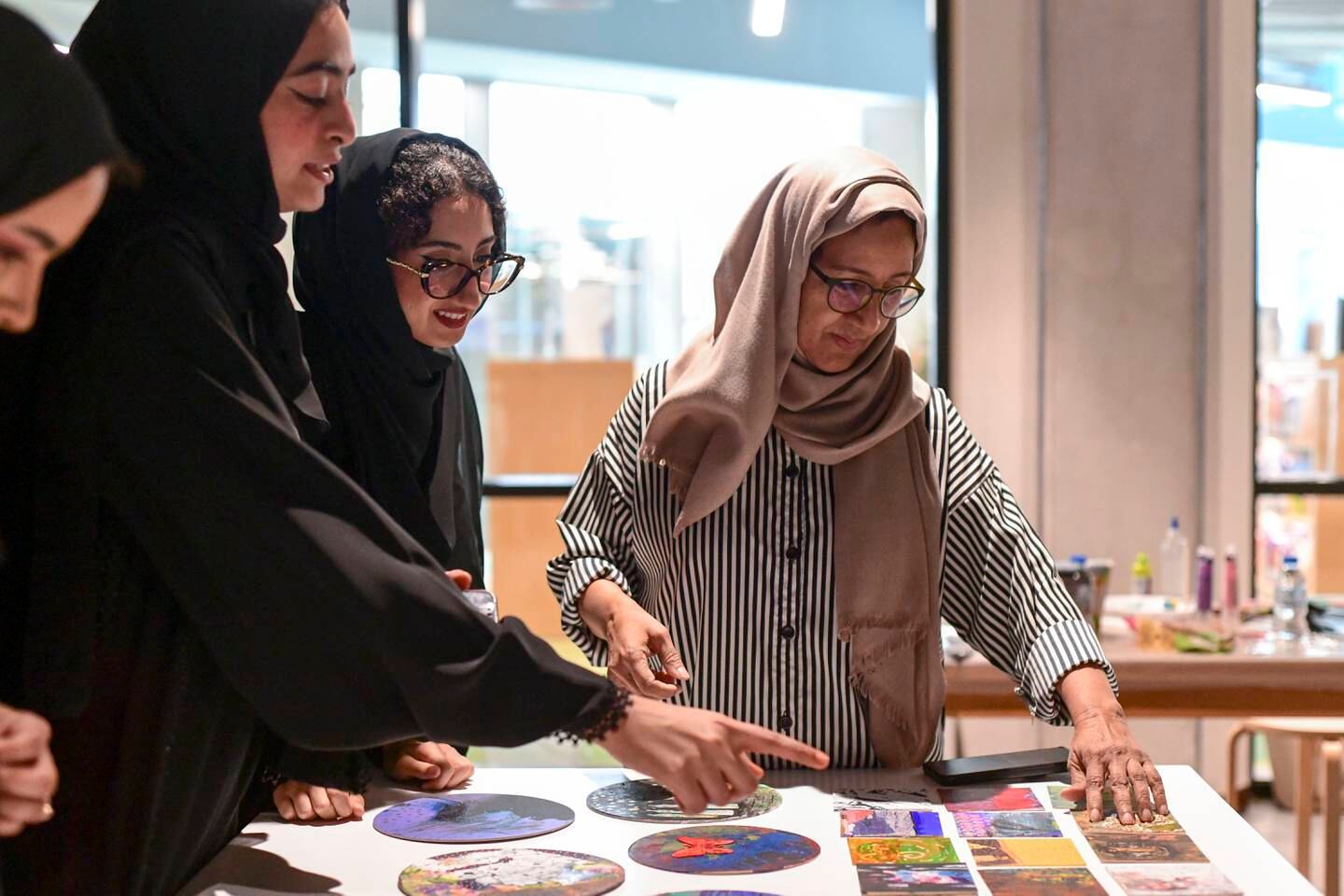 Najat Makki, right, held workshops with students, in collaboration with Guggenheim Abu Dhabi. Khushnum Bhandari / The National