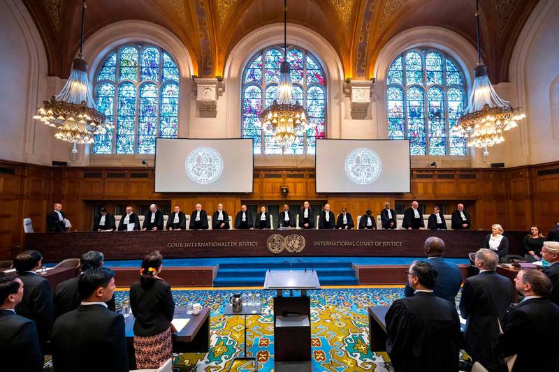 A handout photo released by the International Court of Justice shows a general view of The International Court of Justice (ICJ) holding a public hearing in the case concerning the Application of the Convention on the Prevention and Punishment of the Crime of Genocide (The Gambia v. Myanmar) at the Peace Palace in The Hague, with Myanmar's State Counsellor Aung San Suu Kyi (5thL) and Gambian politician and lawyer Abubacarr Marie Tambadou (4thR) attending.  AFP