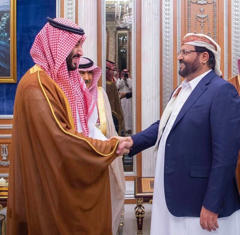The crown prince greets council member Sultan Ali Al Arada.