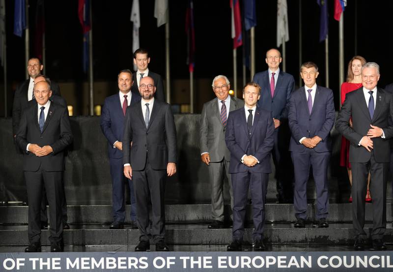 In the front row, from left, Slovenia's Prime Minister Janez Jansa, European Council President Charles Michel, French President Emmanuel Macron and Lithuania's President Gitanas Nauseda. AP