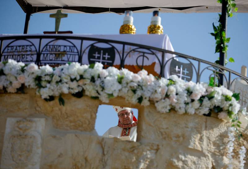 Father Patton conducts a baptism in the Israeli-occupied West Bank.
