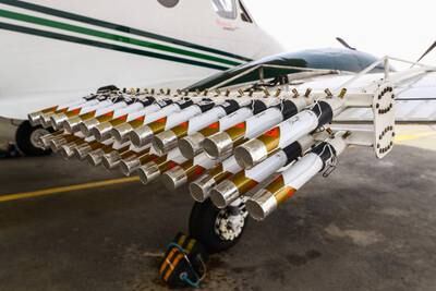 Hygroscopic (water-attracting) salt flares are attached to an aircraft at Al Ain International Airport before a cloud-seeding flight operated by the National Centre of Meteorology. The UAE has been leading the effort to seed clouds and increase precipitation, which remains at less than 100 millimetres a year on average. All photos by Reuters