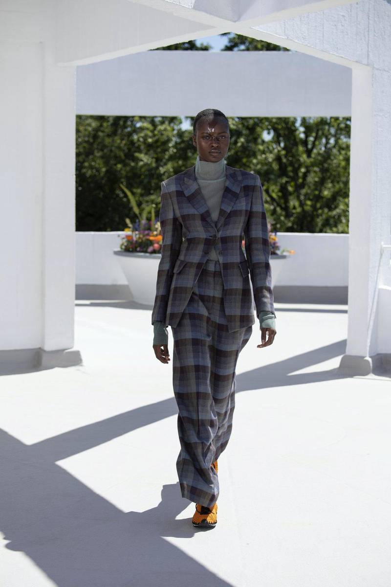 A subtly checked polo neck is worn under a bold checked suit at Qasimi spring / summer 2022. Courtesy Qasimi