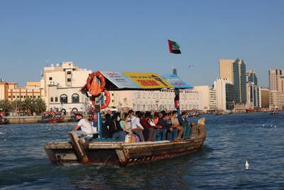 A traditional abra crosses the creek in Deira. AFP