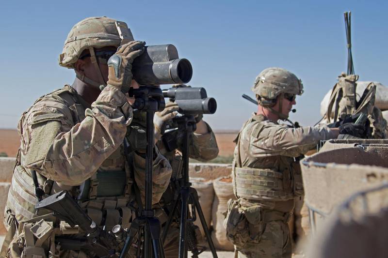 FILE PHOTO: U.S. Soldiers surveil the area during a combined joint patrol in Manbij, Syria, November 1, 2018. Picture taken November 1, 2018. Courtesy Zoe Garbarino/U.S. Army/Handout/File Photo