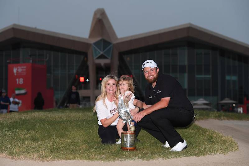 ABU DHABI, UNITED ARAB EMIRATES - JANUARY 19:  Shane Lowry of Ireland celebrates with wife Wendy Honner, daughter Iris Lowry and the trophy after winning during Day Four of the Abu Dhabi HSBC Golf Championship at Abu Dhabi Golf Club on January 19, 2019 in Abu Dhabi, United Arab Emirates. (Photo by Ross Kinnaird/Getty Images)
