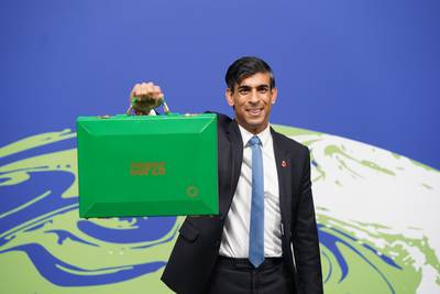 Rishi Sunak, Britain’s Chancellor of the Exchequer, holds his green box at the Cop26 summit in Glasgow, before a meeting a group of finance ministers. PA