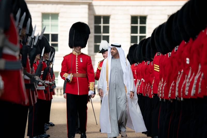 Sheikh Mohamed bin Zayed reviews a military guard of honour at Horse Guards Parade shortly after his arrival in London. Ministry of Presidential Affairs