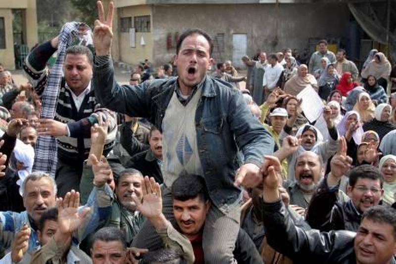 Around 1,200 workers strike at the Oil and Soap Factory in the city of Mansoura, Egypt, Thursday, Feb. 17, 2011. Growing labor unrest, rekindled by the 18-day uprising that toppled longtime leader Hosni Mubarak, is deepening economic malaise and compounded by weeks of bank closures that are hampering business operations and the drying up of tourism - a major money earner for Egypt. (AP Photo) *** Local Caption ***  CAI101_Mideast_Egypt_.jpg