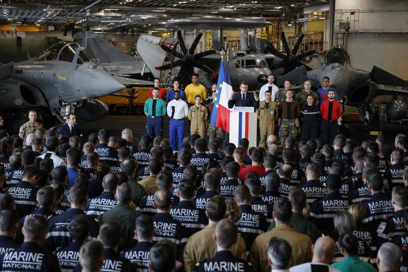 Mr Macron delivers a speech to navy personnel aboard the Charles de Gaulle in Egypt