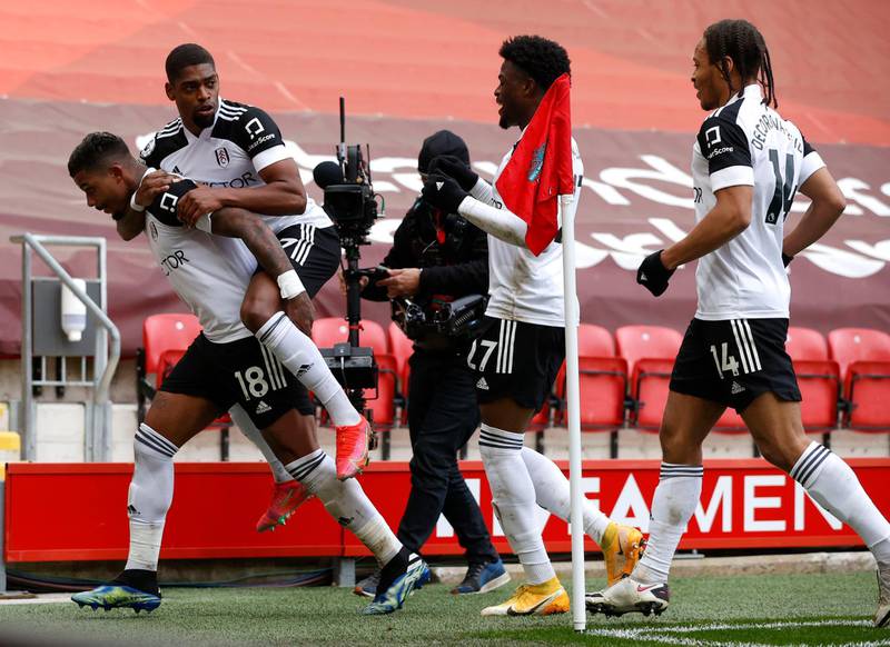 Fulham's Mario Lemina celebrates with teammates after scoring the winner. PA