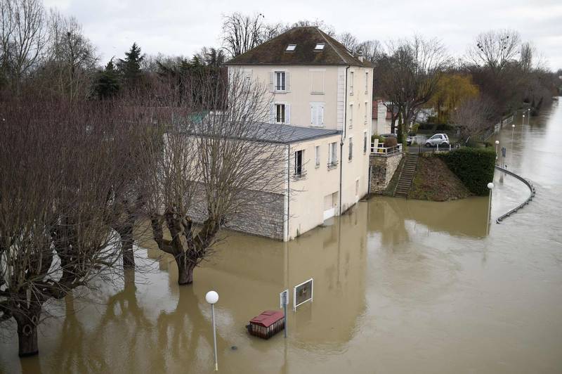 A house surrounded by floodwater from the Seine river in Bougival, west of Paris. Stephane De Sakutin / AFP