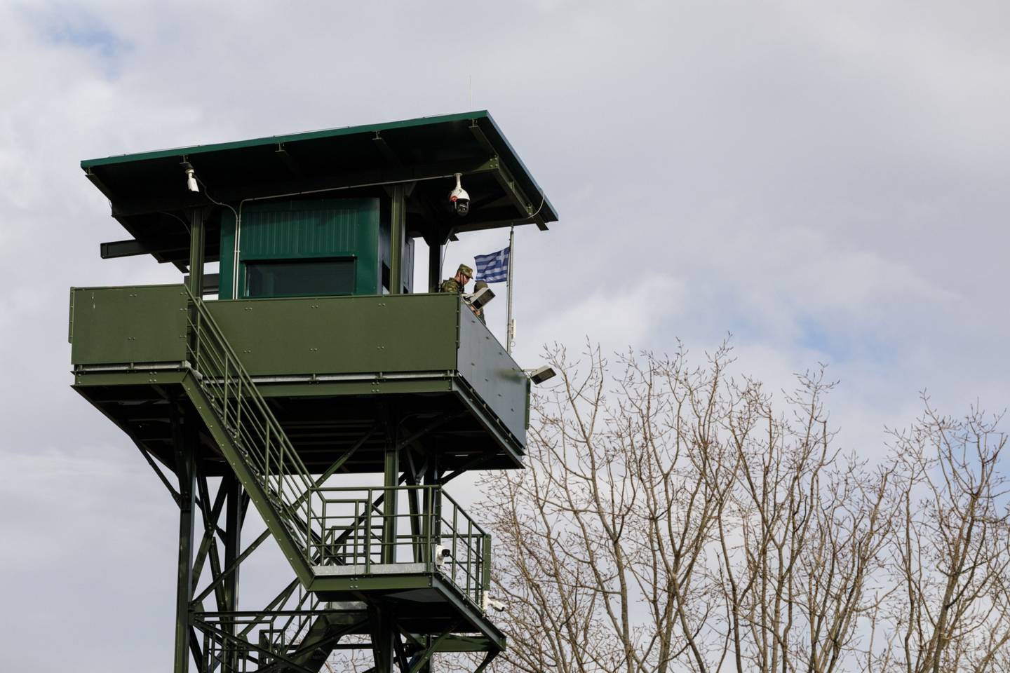 A Greek border guard in an observation tower at the frontier with Turkey. Bloomberg