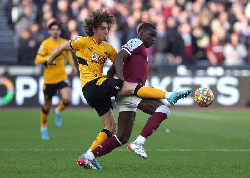 West Ham United's Kurt Zouma fights for the ball with Wolverhampton Wanderers' Fabio Silva. Reuters