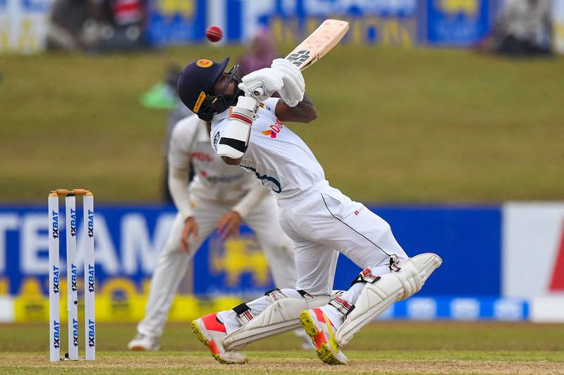 Sri Lanka's Niroshan Dickwella avoids a bouncer on Day 1 of the second Test against Pakistan at Galle International Cricket Stadium on Sunday, July 24, 2022. AFP