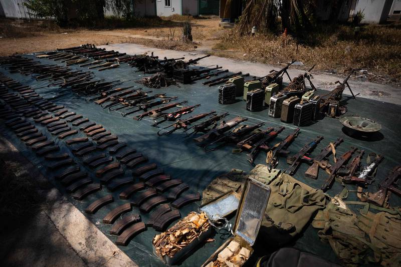 Weapons confiscated from insurgents are displayed in the Mozambique port city of Mocimboa da Praia in 2021. AFP