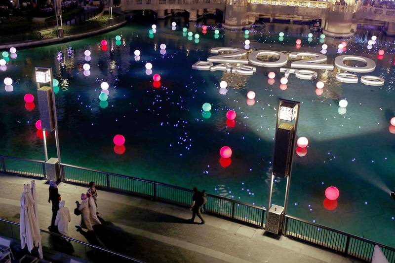 Celebrations underway at the Dubai Mall Fountain where members of the public could register and write their wish on an LED ball which was then set afloat in the fountain. Antonie Robertson/ The National