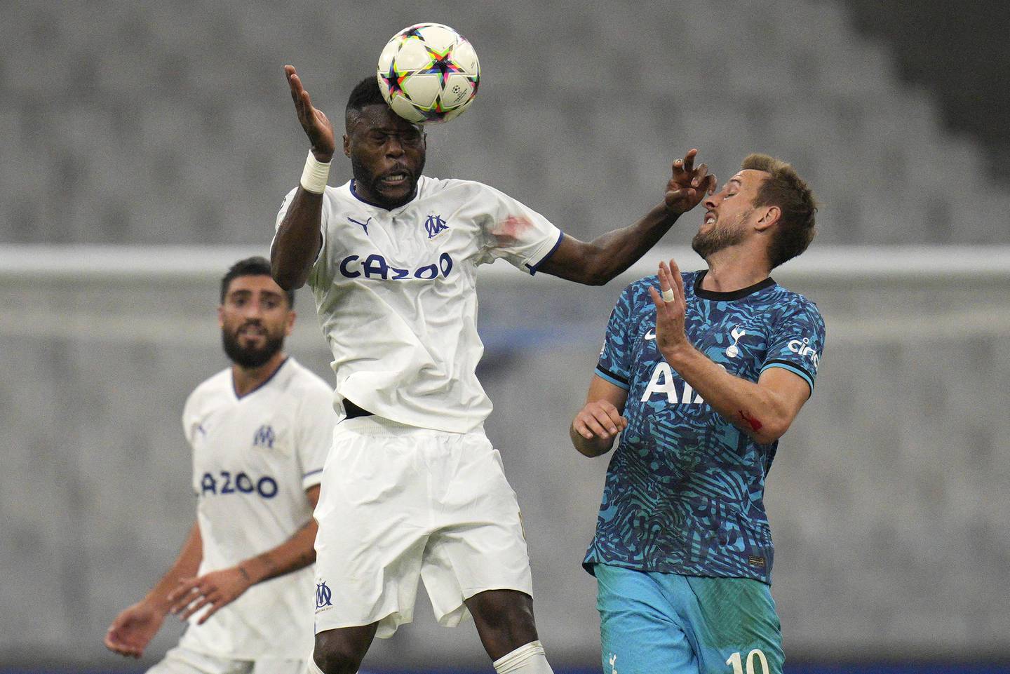 Marseille's Chancel Mbemba challenges Tottenham's Harry Kane. AP Photo 