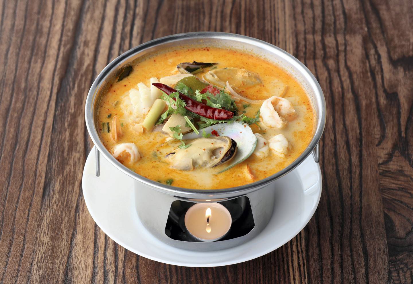 Dubai, United Arab Emirates - August 17, 2019: Seafood Soup - ÒTom Yum TalayÓ. Mother and son duo open Thai restaurant: Mohamed Abedin, Emirati, and his Thai mother, Amena Rakkuson. Saturday the 17th of August 2019. JVC, Dubai. Chris Whiteoak / The National