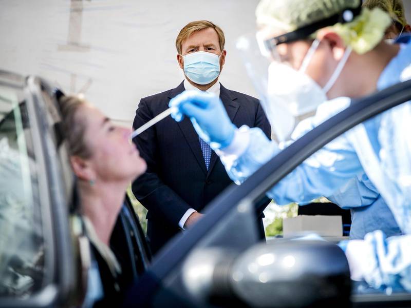 Netherland's King Willem-Alexander looks on as he visits a coronavirus (Covid-19) test site in Leiderdorp, The Netherlands. AFP