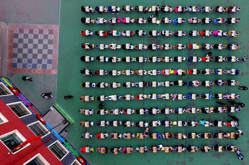 Chinese students and their parents take part in a chess contest during an Open Day at a primary school in Shenyang in northeast China’s Liaoning province. AFP