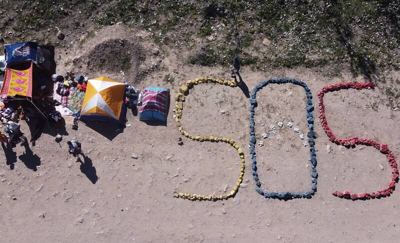 Venezuelan migrants made this SOS sign at their campsite near the border between Mexico and the US. EPA