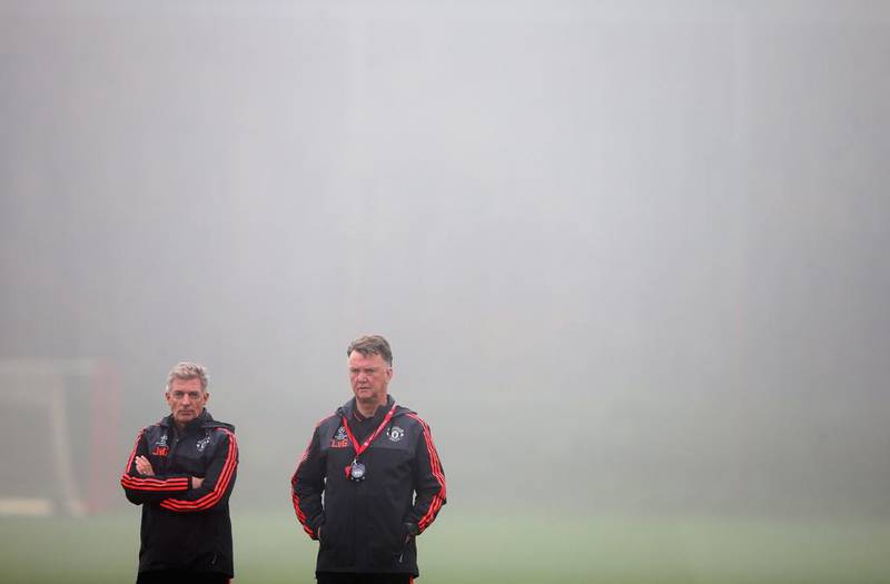 Louis van Gaal the manager of Manchester United looks on in the fog during a Manchester United training session on the eve of the UEFA Champions League Group B match against CSKA Moscow at Aon Training Complex on November 2, 2015 in Manchester, England. (Photo by Alex Livesey/Getty Images) 