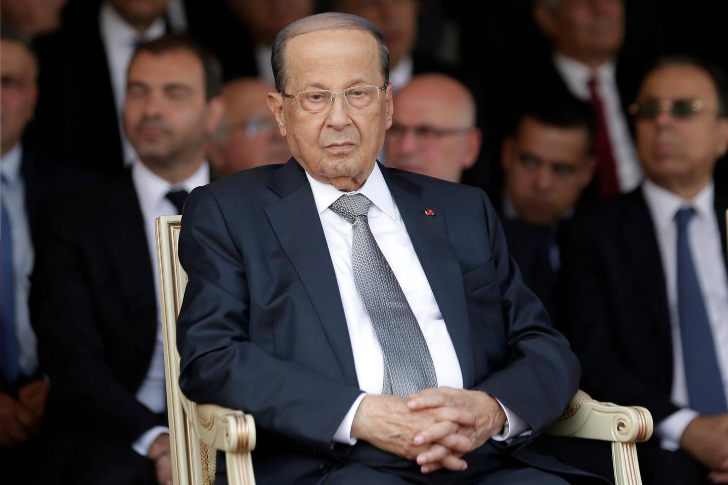 FILE - In this Aug. 1, 2019 file photo, Lebanese President Michel Aoun attends a graduation ceremony marking the 74th Army Day, at a military barracks in Beirut's suburb of Fayadiyeh, Lebanon. Aoun said Saturday, Aug. 24,  his country will emerge from its difficult economic conditions by making decisions that boost production, and a top politician said politicians will be called for a meeting â€œto discuss the challenges.â€ His comments came a day after Fitch Ratings downgraded Lebanon's long-term foreign currency issuer default rating to CCC from B-. (AP Photo/Hassan Ammar, File)