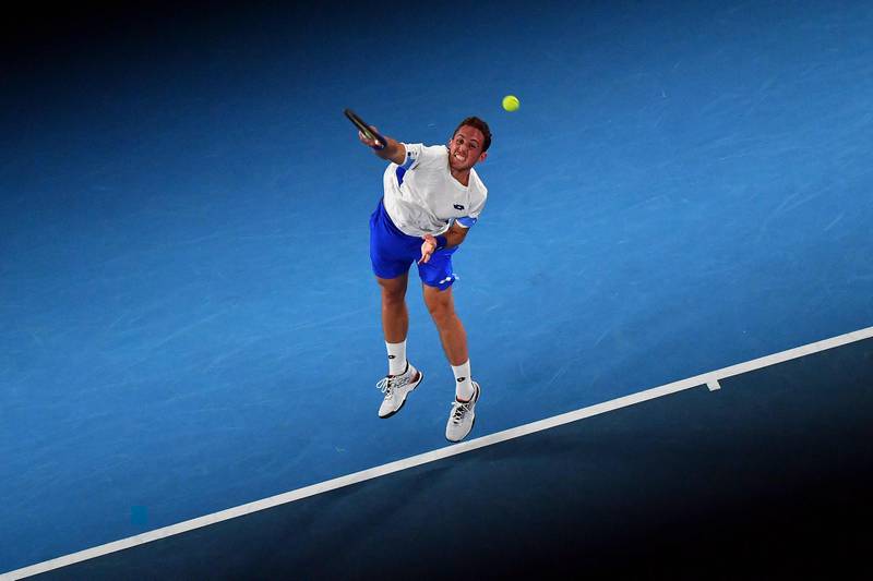 Spain's Roberto Carballes Baena serves against Novak Djokovic. AFP