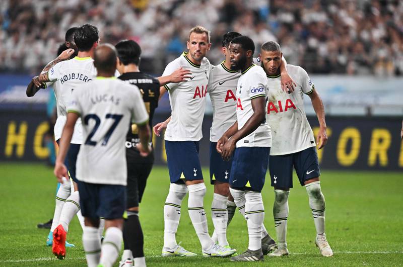 Spurs striker Harry Kane celebrates scoring with teammates. AFP