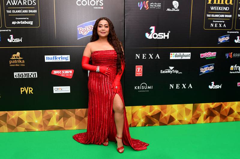 Neha Kakkar Singh in a red gown with matching gloves and shoes. AFP 