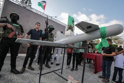 Hamas armed fighters stand guard during an exhibition of military hardware in Gaza city on June 30. EPA