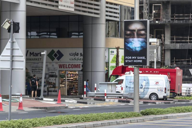 DUBAI, UNITED ARAB EMIRATES. 16 APRIL 2020. General STANALONE image for COVID coverage. A sign warns people to stay home along the Dubai Marina. (Photo: Antonie Robertson/The National) Journalist: STANDALONE. Section: National.